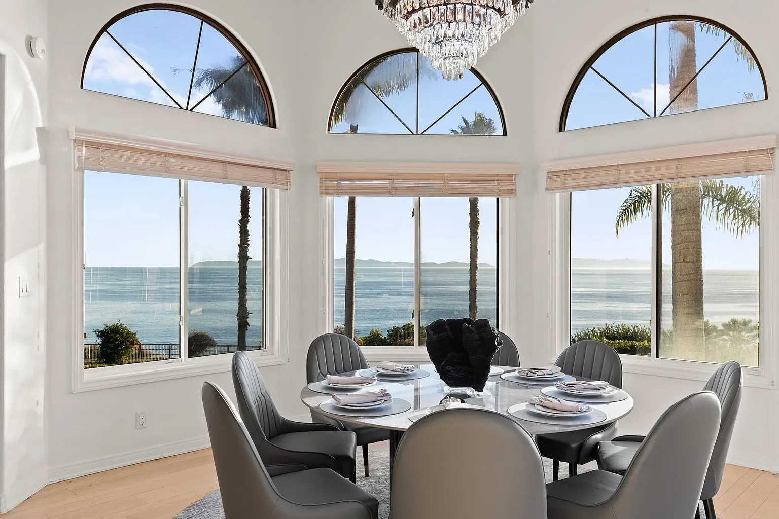 Dining room with arched windows over the Pacific