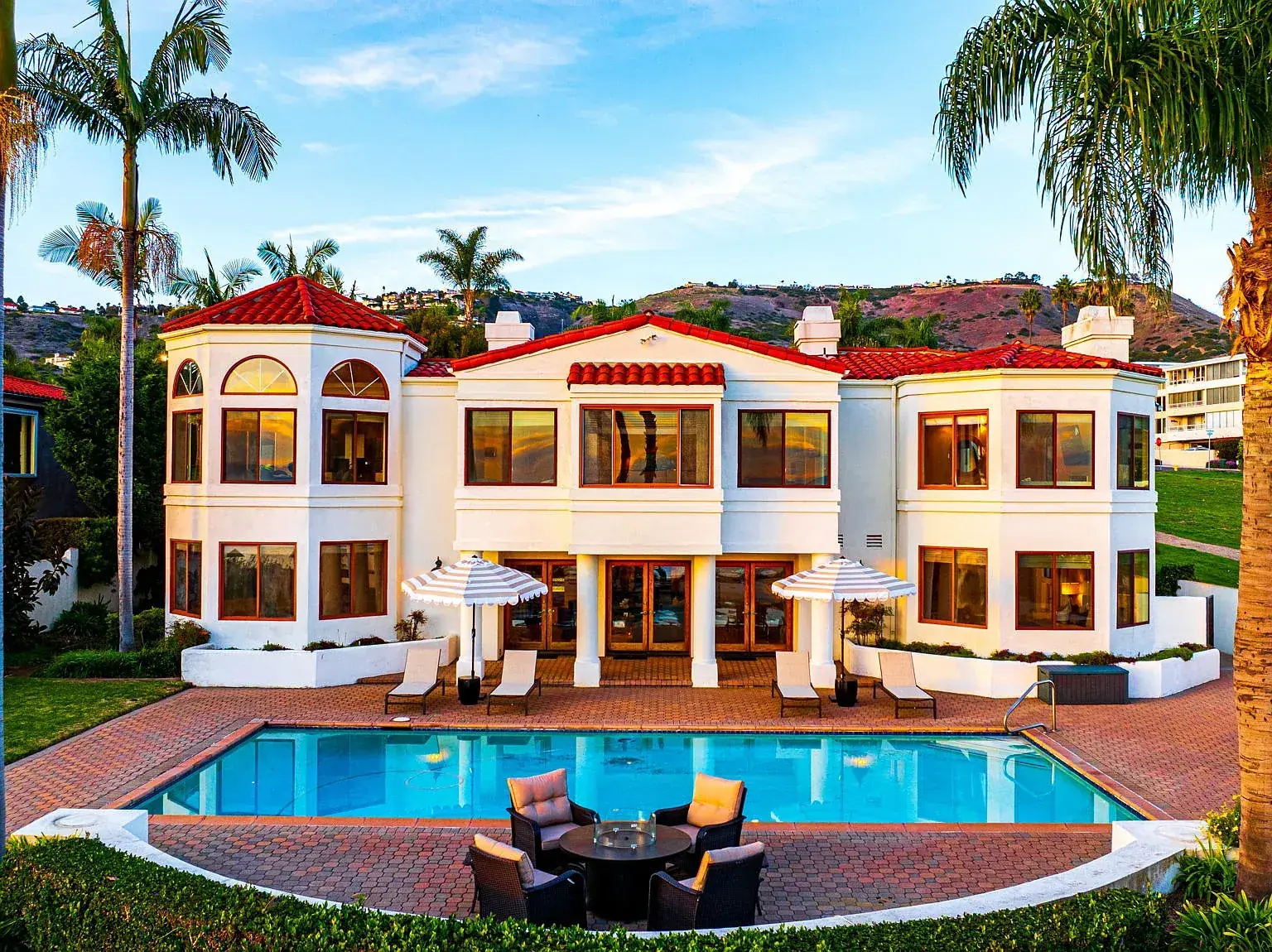 The Sakina House oceanfront residence with pool at golden hour, Palos Verdes